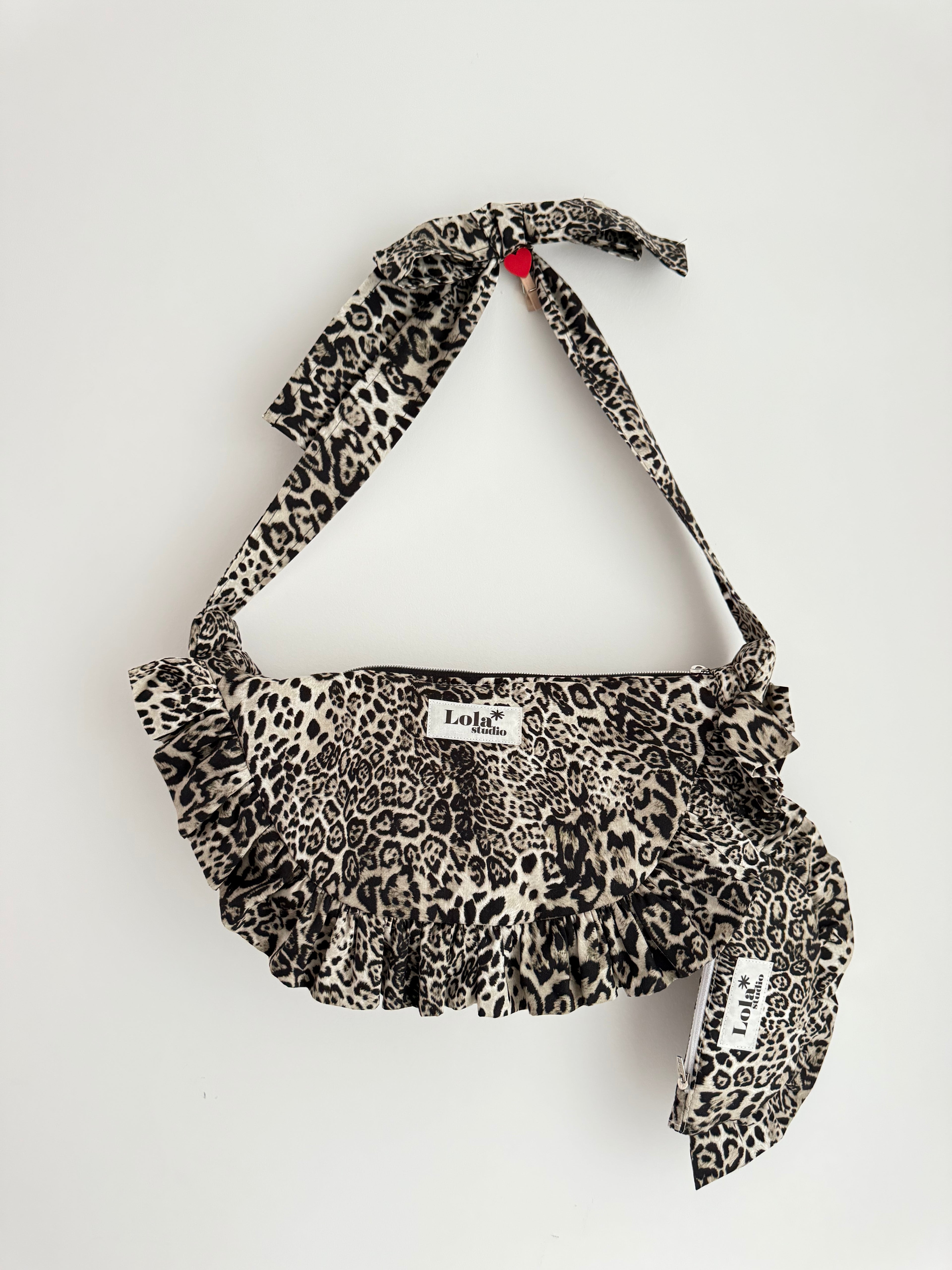 Leopard print bag lolastar studio beginner sewing pattern crescent ruffle bag with a tie strap on a white background